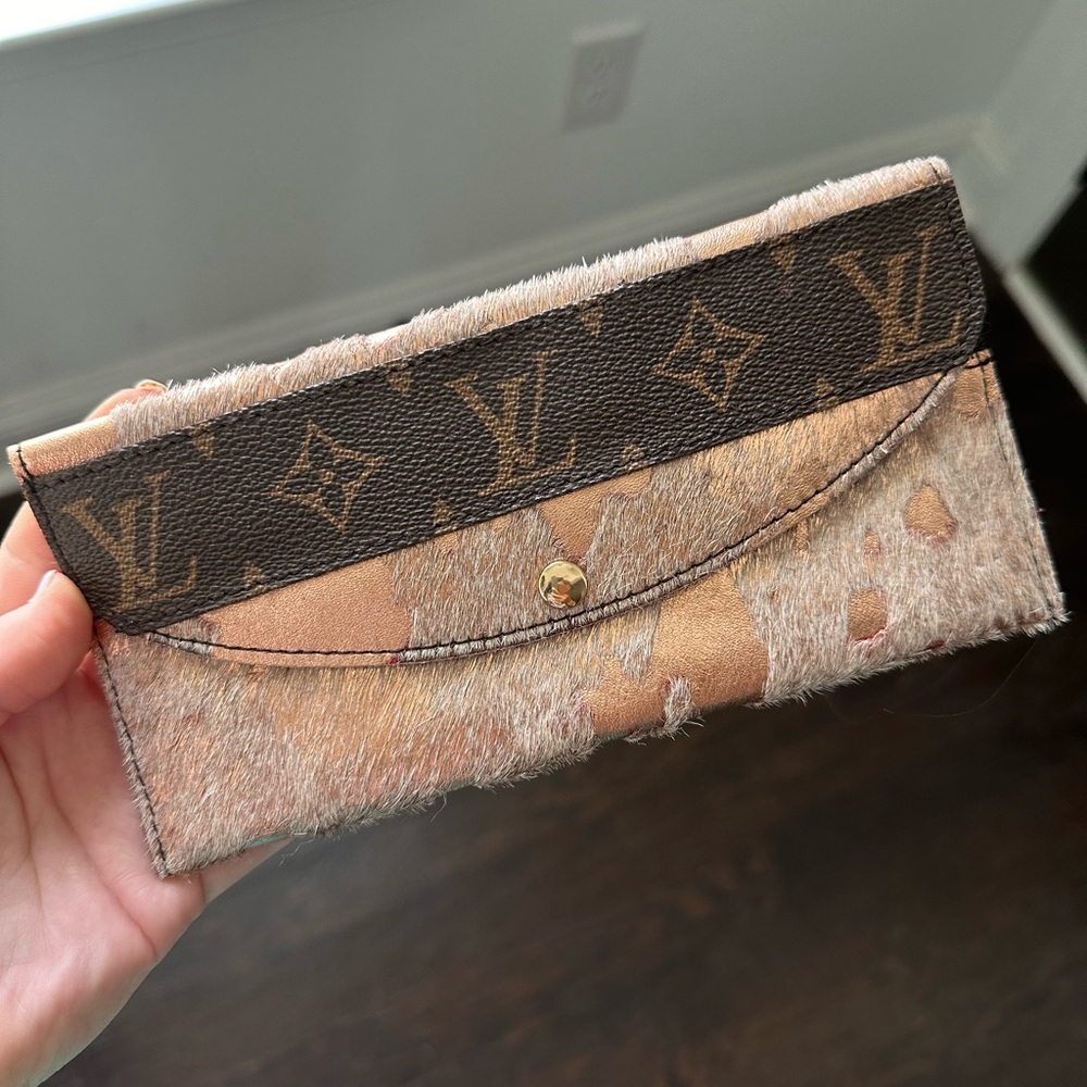 Rose gold cowhide LV wallet. Was a gift Never used/like new condition.
